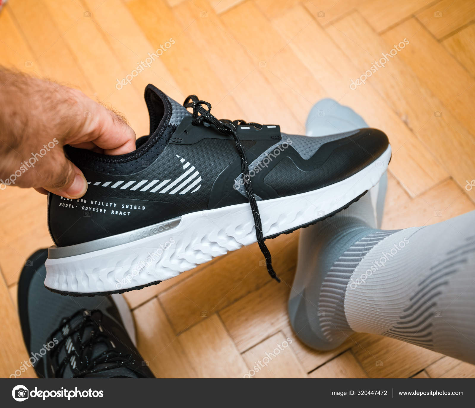 Man testing model Odyssey React Shield 2 shoes Stock Editorial Photo © #320447472