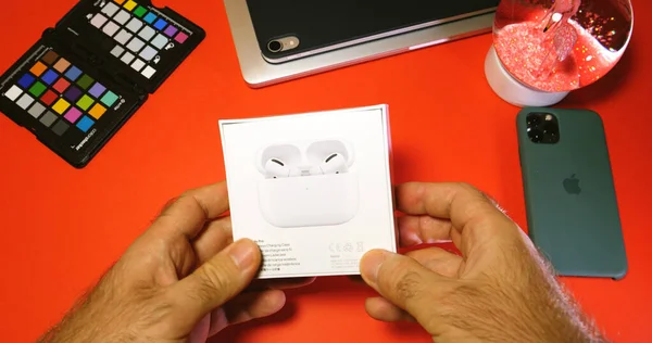 New Apple Computers Airpods Pro headphones unboxing — стокове фото