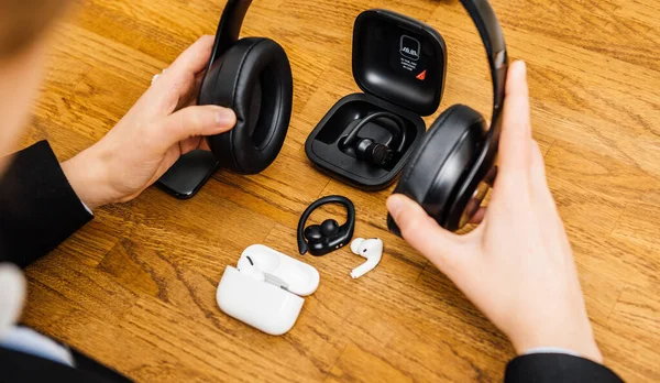 Woman testing latest Apple Computers AirPods Pro headphones — Stock Photo, Image
