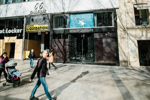 Mauboussin fashion French jewellery firm flagship store with protected closed showcase windows entrance on Champs Elysees avenue during Yellow Jackets Gilets Jaunes strike movement — Stock Photo, Image