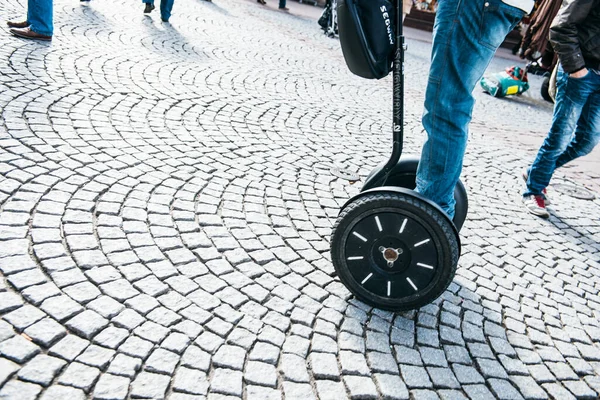 Tourist driving a Segway in central Strasbourg on the cobblestone — Stock Photo, Image