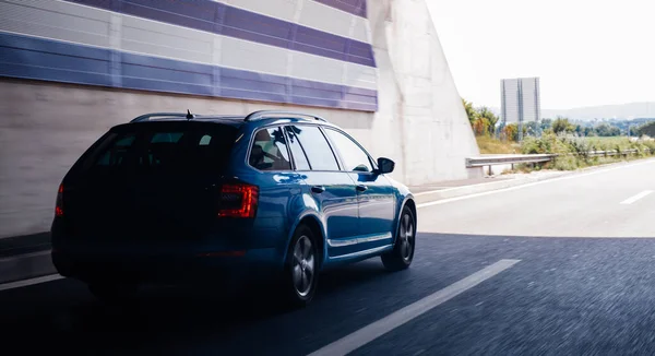 New driving fast Skoda Octavia estate car exiting the tunnel — Stock Photo, Image