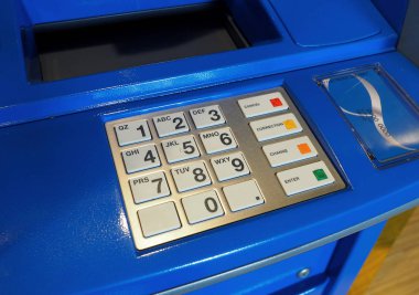 Mavi renk Atm makine ve beyaz düğme tuş takımı.