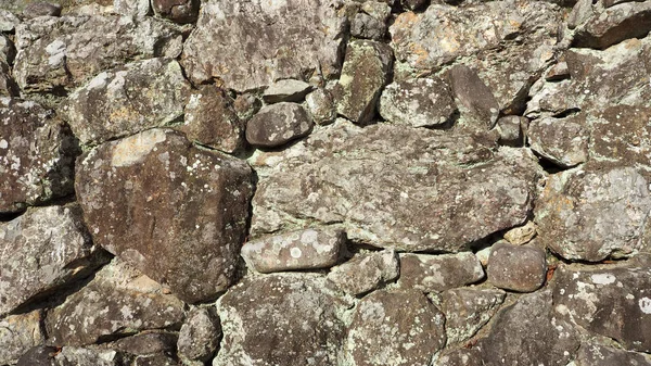 Texture de mur en pierre forte et ancienne . — Photo