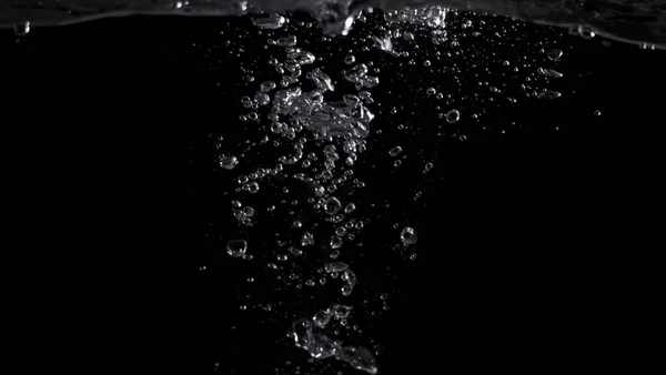 Bubbles underwater splashing and floating up and black color background which represent carbonate drink such as soda or cola and sparkling water from nature that can use for refreshing or freshing concept