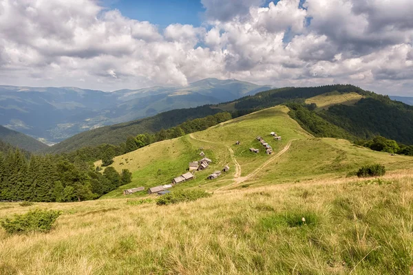 stock image Summer landscape in mountains and the dark blue sky with clouds