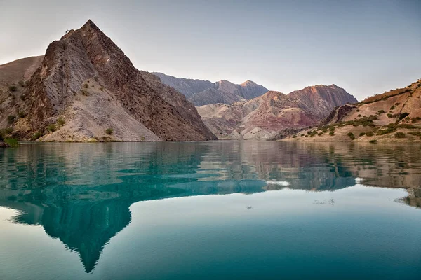 The mountain river is shrouded in mountains