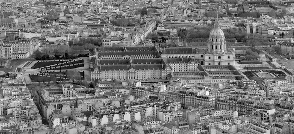 Aerial view of Paris from above with a Sacre Coeur on the horizon. .