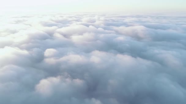 Aerial View. Flying in fog, fly in mist. Aerial camera shot. Flight above the clouds towards the sun. Misty weather, view from above. — Stock Video