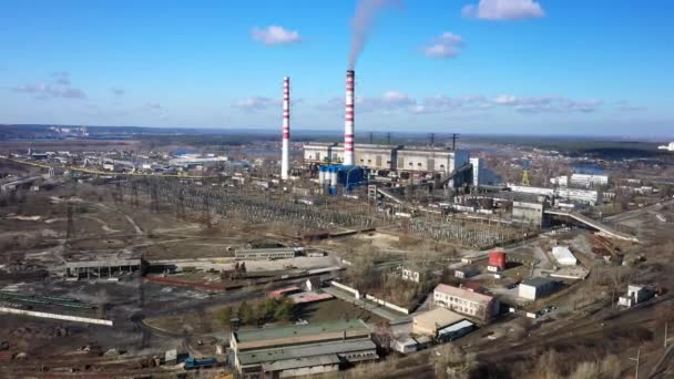 Aerial view of high chimney pipes with grey smoke from coal power plant. Production of electricity with fossil fuel. — Stock Video