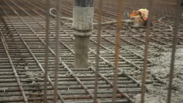 Pouring concrete mix from cement mixer on concreting formwork. Finished leveling the slab and pouring the concrete basement floor. — Stock Video