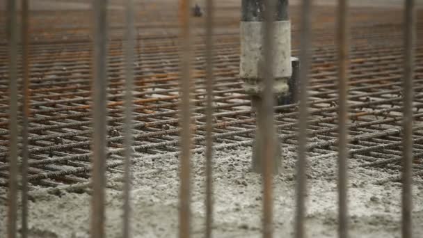 Pouring concrete mix from cement mixer on concreting formwork. Finished leveling the slab and pouring the concrete basement floor. — Stock Video