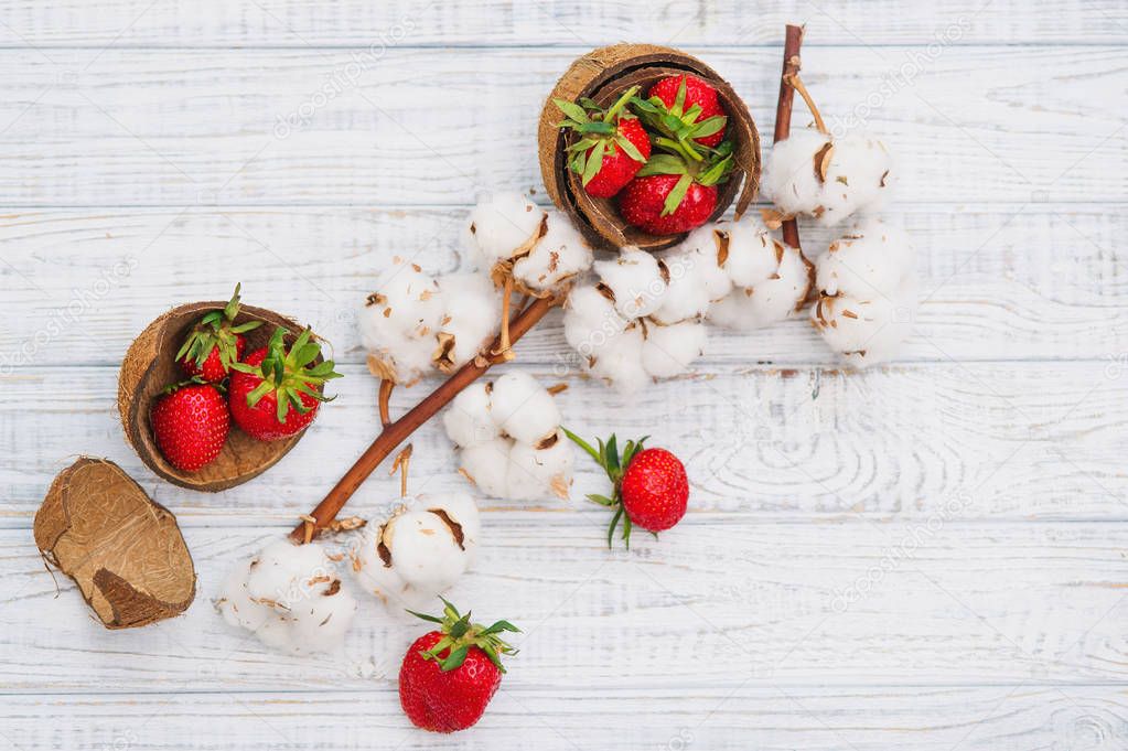 Ripe strawberries and cotton flowers