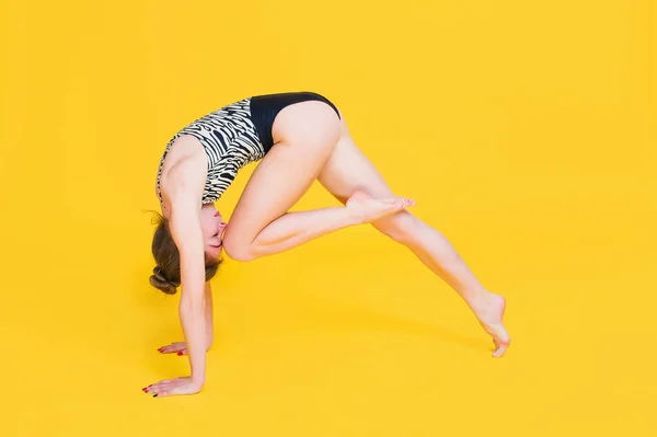 Young fit woman gymnast stretching