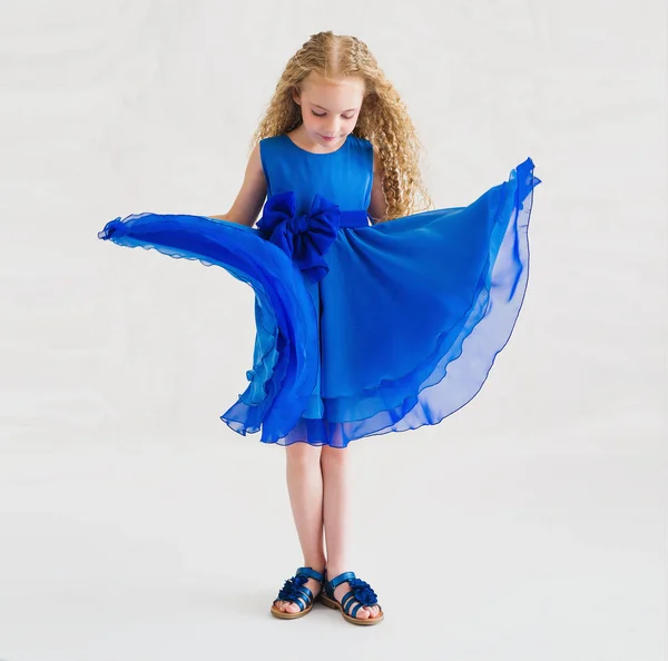 Beautiful little girl wearing trendy blue dress — Stock Photo, Image