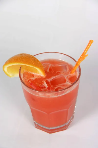 Orange cocktail with ice on white background — Stock Photo, Image