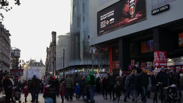 LONDON, ENGLAND - December 21: Centre London Cinema and Shopping Street in Leicester Square Theatreland in London People Walk Visit ( Ultra High Definition, Ultra HD, UHD, 4K, real time ) — Stock Video