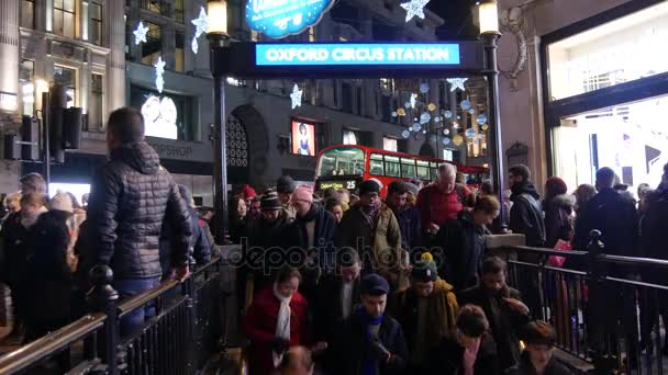 London, UK, december 19: The tube station at Oxford Circus is flooded every day with commuters on their way home after work, the station entrance struggles to cope with the volume of people, — Stock Video