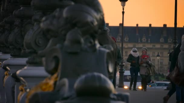 PARIS FRANCE - circa 2017: Pont Alexandre III bridge with the Eiffel Tower in the background in sunset, ultra hd 4k — Stock Video