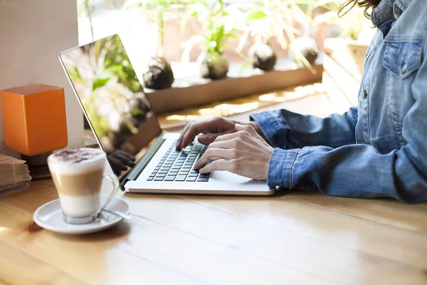 Blue jeans jacket woman typing laptop — Stock Photo, Image