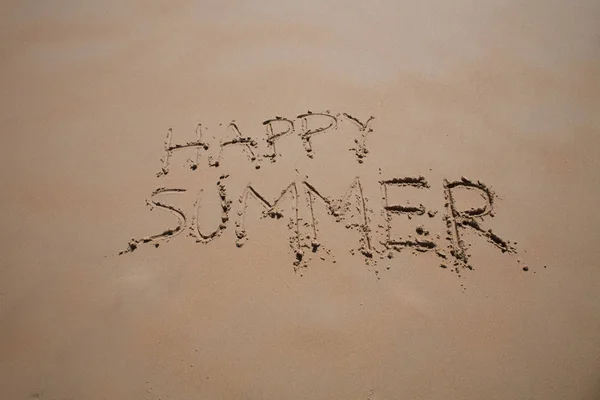 happy summer text in sand beach