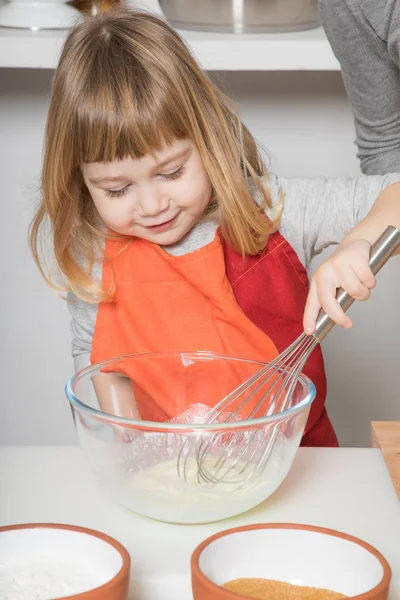 Child cooking whipping yogurt — Stock Photo, Image