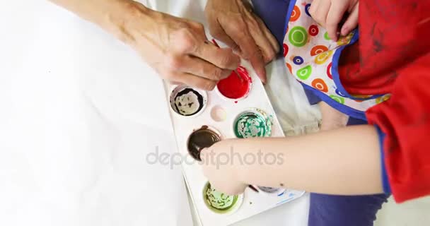 Mother and child hands preparing watercolor to paint — Stock Video