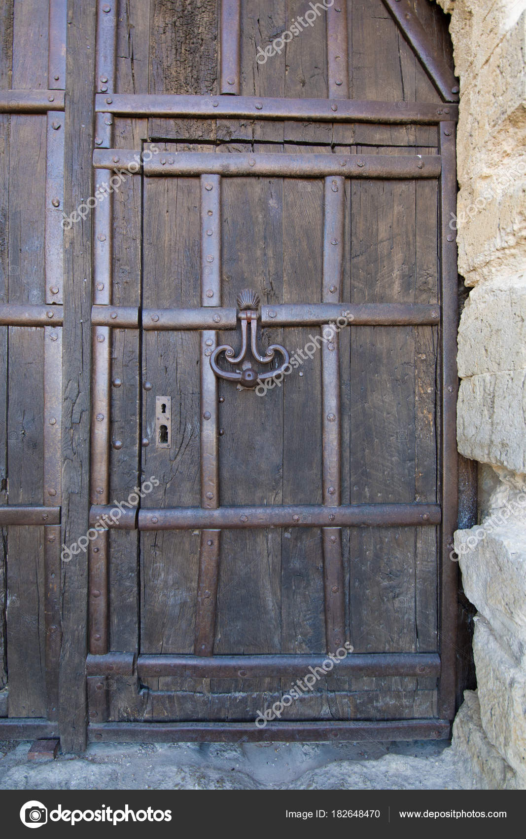 Wooden Door And Ancient Knocker Of Castle Stock Photo
