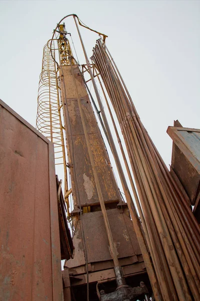 Construction site with hydraulic drilling machines and pipes — Stock Photo, Image