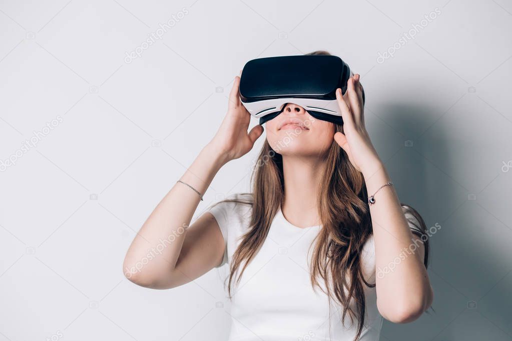 Happy woman using a virtual reality headset