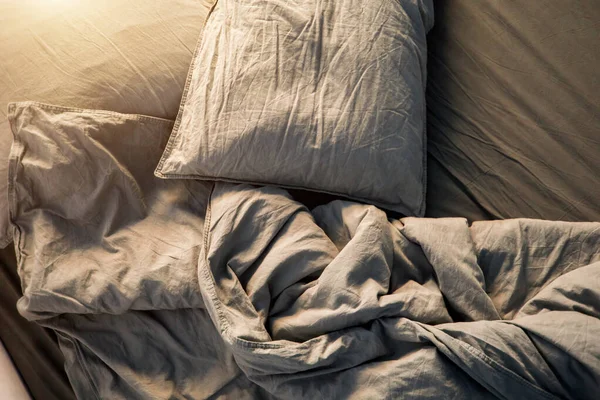 Blue bed sheets and pillows after night's sleep. — Stock Photo, Image