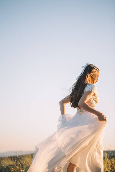 Beautiful bride outdoors in a forest.