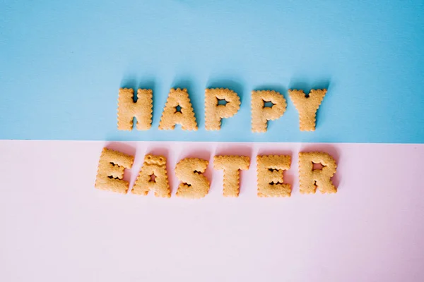 Feliz fundo de Páscoa, letras de biscoitos — Fotografia de Stock