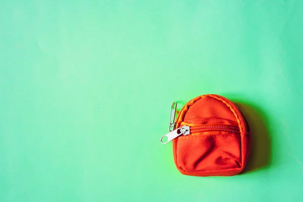 Orange backpack isolated on mint background — Stock Photo, Image