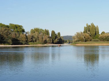 Beauty Rhine River landscape reflected in water seen from european STEIN am RHEIN town at canton of Schaffhausen in SWITZERLAND, clear blue sky in 2018 warm sunny summer day on August.