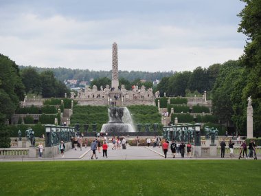 View to monolith of Vigeland at Frogner Park in european city of Oslo in Norway with cloudy sky in 2019 cold summer day on July.