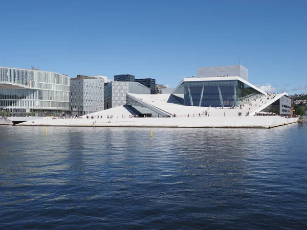 Wonderful view to european Oslo capital city reflected in water in Norway at Ostlandet district, clear blue sky in 2019 warm sunny summer day in July.