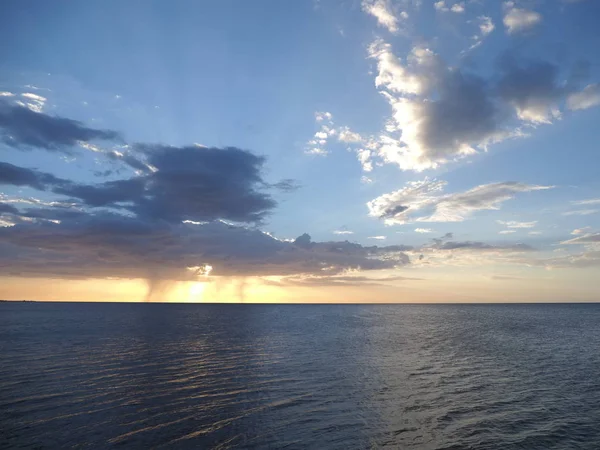 Brilliant sunset at bay of Campeche city at state of Tabasco in Mexico, Pacific Ocean with cloudy blue sky in 2018 warm winter evening, North America on February.