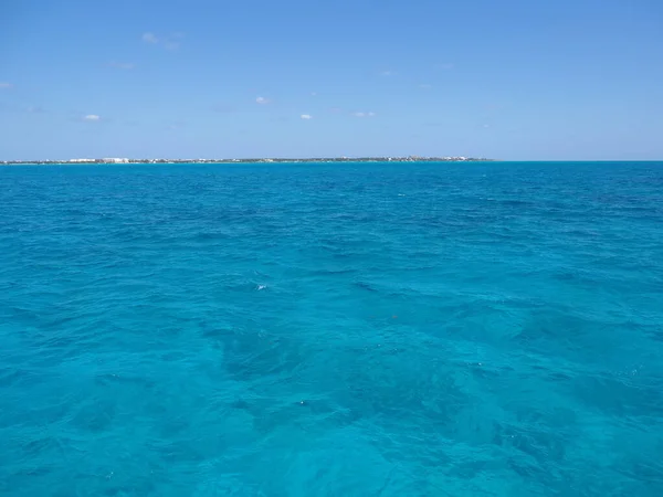 Clear water between Isla Mujeres and Cancun city at Quintana Roo state in Mexico, clear blue sky in 2018 hot sunny winter day, North America on March.