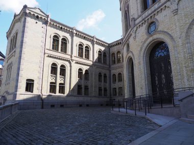 Site of Stortinget parliament in european Oslo capital city at Ostlandet district in Norway, clear blue sky in 2019 warm sunny summer day on July.