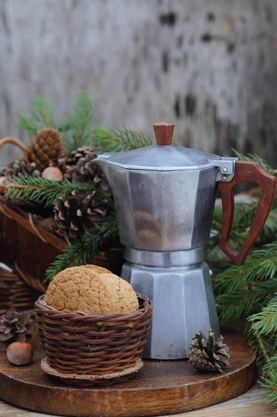 Vintage coffee maker pot with coffee and basket with cookies on holiday wooden table — Stock Photo, Image