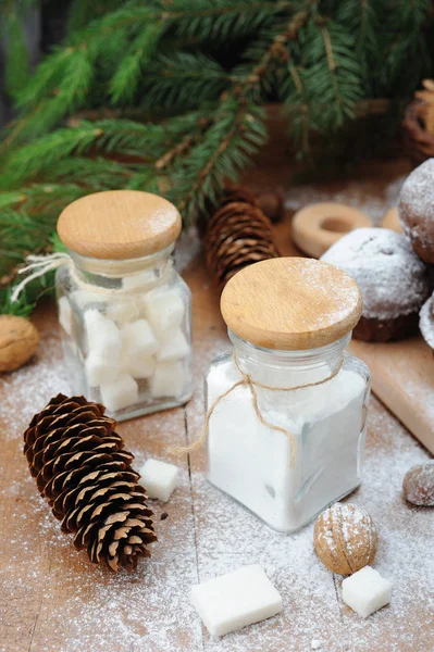 Little cupcakes with holiday decorations on rustic table — Stock Photo, Image