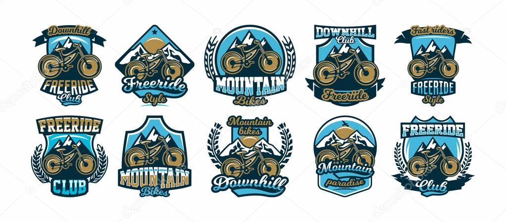 A collection of colorful logos, labels, logos, mountain bike mountains in the background using a variety of lettering, isolated vector illustration. Club downhill, freeride. Print on T-shirts
