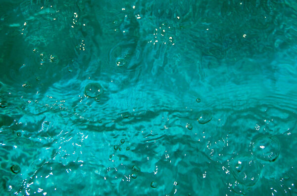 Blue background of water with waves.