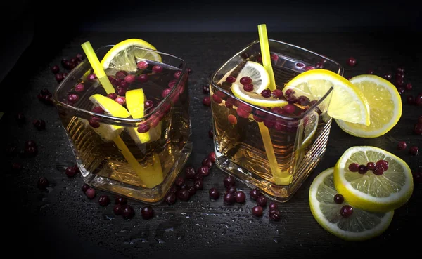 A refreshing cocktail. Summer cocktail with lemon. Glass with a drink. Close-up, view from the top.