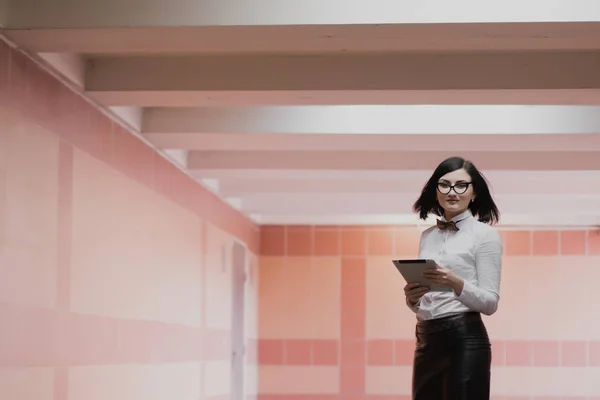 Modern business, female businessman is working in an underground passage over a new idea