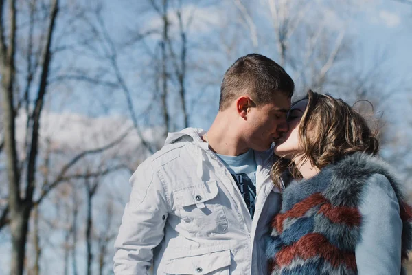 Happy couple in love hugging and sharing emotions, holding hands walking in the park — Stock Photo, Image