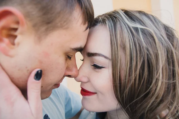 Happy couple in love hugging and sharing emotions, holding hands walking in the park — Stock Photo, Image