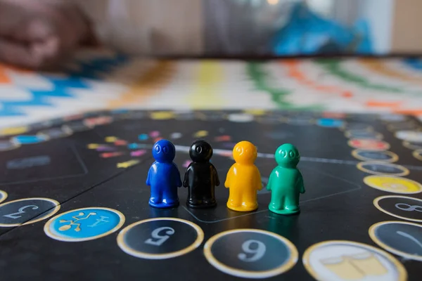 Multi-colored chips for tabletop game in the form of little men
