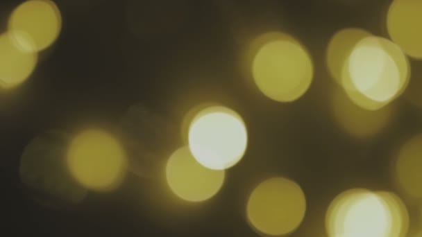 Fondo dorado, borroso, con luces bokeh. Los destellos abstractos. Bucle Full HD, 1080p — Vídeo de stock